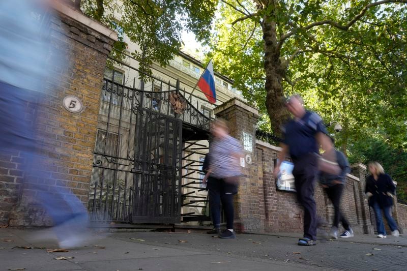 People walk past the Russian Embassy in London, Friday, Sept. 13, 2024. (AP Photo/Frank Augstein)