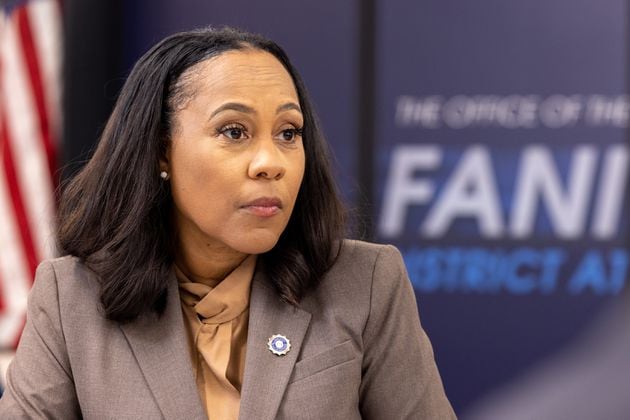 Fulton County District Attorney Fani Willis listens during a press interview at the district attorney’s office in Atlanta on Friday, July 12, 2024. (Arvin Temkar / AJC)