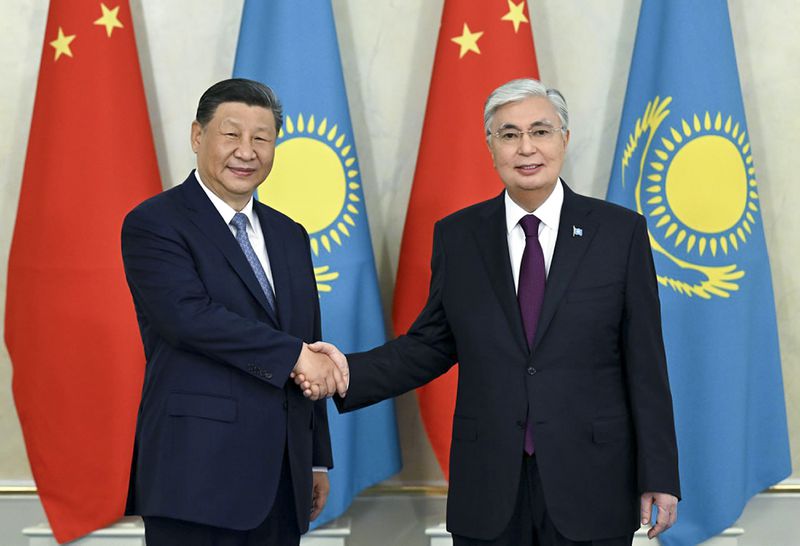 In this photo released by Kazakhstan's Presidential Press Office, President Kassym-Jomart Tokayev, right, and Chinese President Xi Jinping pose for a photo prior to their talks at the palace in Astana, Kazakhstan, on Wednesday, July 3, 2024. (Kazakhstan's Presidential Press Office via AP)