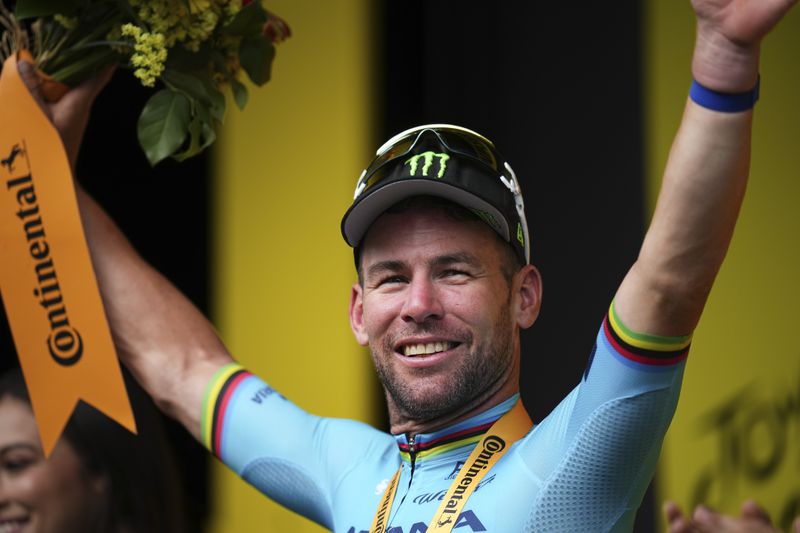 Britain's sprinter Mark Cavendish celebrates his record 35th Tour de France stage win to break the record of Belgian legend Eddy Merckx in the fifth stage of the Tour de France cycling race over 177.4 kilometers (110.2 miles) with start in Saint-Jean-de-Maurienne and finish in Saint-Vulbas, France, Wednesday, July 3, 2024. (AP Photo/Daniel Cole)