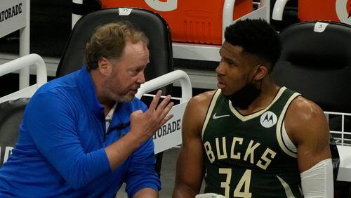 Two of the Hawks chief concerns now: Milwaukee Bucks head coach Mike Budenholzer and Giannis Antetokounmpo, here conferring during a playoff game vs. Brooklyn. (AP Photo/Morry Gash)