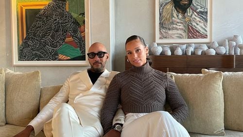 Alicia Keys and Swizz Beatz in their La Jolla, California, home with paintings by Toyin Ojih Odutola, "Paris Apartment" (left) and "The Envoy."