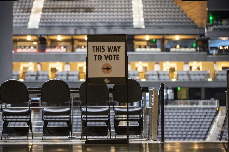 Informative signs are displayed around State Farm Arena in Atlanta, Wednesday, October 7, 2020. State Farm Arena will be open and equipped for Fulton County early voting this presidential election. The arena will not be open for Election Day voting, Tuesday, Nov. 3. (Alyssa Pointer / Alyssa.Pointer@ajc.com)