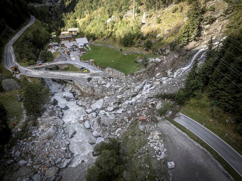 A road is blocked in Eisten, Switzerland, Friday, Sept. 6, 2024, after a landslide following severe weather. (Andrea Soltermann/Keystone via AP)