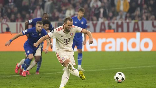 Bayern's Harry Kane scores his sides 7th goal and his 4th of the game from the penalty spot during the Champions League opening phase soccer match between Bayern Munich and GNK Dinamo at the Allianz Arena in Munich, Germany Tuesday, Sept. 17, 2024. (AP Photo/Matthias Schrader)