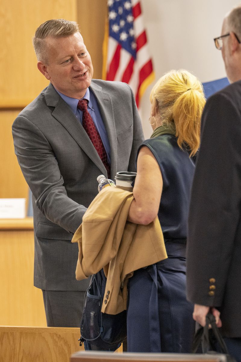 Jason Neubauer, Board Chairman speaks with Amber Bay, Former OceanGate Director of Administration after her testimony at the Titan marine board of investigation hearing inside the Charleston County Council Chambers Tuesday, Sept. 24, 2024, in North Charleston, S.C. (Corey Connor via AP, Pool)