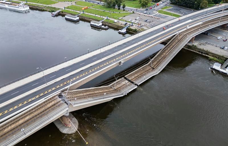 Parts of the Carola Bridge over the Elbe have collapsed in Dresden, Germany, Wednesday, Sept. 11, 2024. (Robert Michael/dpa via AP)