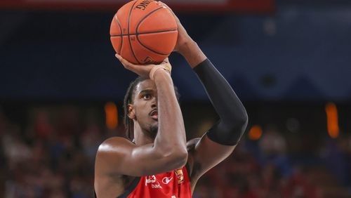 France's Alexandre Sarr of the Wildcats takes a free throw against the Cairns Taipans during a basketball game in Perth, Australia, Saturday, Feb. 10, 2024. This year's NBA draft may be one of the weakest in years, with no clear-cut choice at No. 1 and an overall lack of depth. What it will likely have again this year: a French connection at the top. A year after San Antonio selected Victor Wembanyama with the No. 1 pick, fellow Frenchmen Sarr and Zaccharie Risacher could go 1-2 in the June 26 draft. (Richard Wainwright/AAP Image via AP)