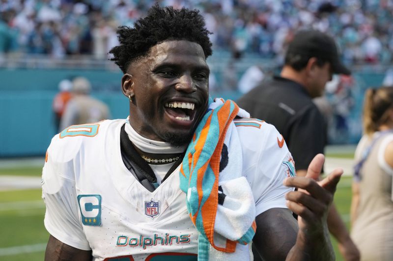 Miami Dolphins wide receiver Tyreek Hill gestures after an NFL football game against the Jacksonville Jaguars, Sunday, Sept. 8, 2024, in Miami Gardens, Fla. The Dolphins defeated the Jaguars 20-17. (AP Photo/Wilfredo Lee)