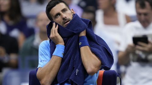 Novak Djokovic, of Serbia, wipes his face during a third round match against Alexei Popyrin, of Australia, of the U.S. Open tennis championships, Friday, Aug. 30, 2024, in New York. (AP Photo/Julia Nikhinson)