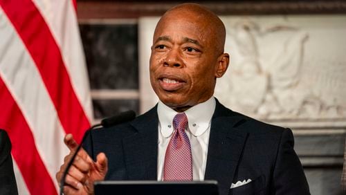 FILE - Mayor Eric Adams speaks during a press conference at City Hall in New York, Dec. 12, 2023. (AP Photo/Peter K. Afriyie, File)