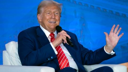 Republican presidential nominee former President Donald Trump speaks with Moms for Liberty co-founder Tiffany Justice during an event at the group's annual convention in Washington, Friday, Aug. 30, 2024. (AP Photo/Jose Luis Magana)