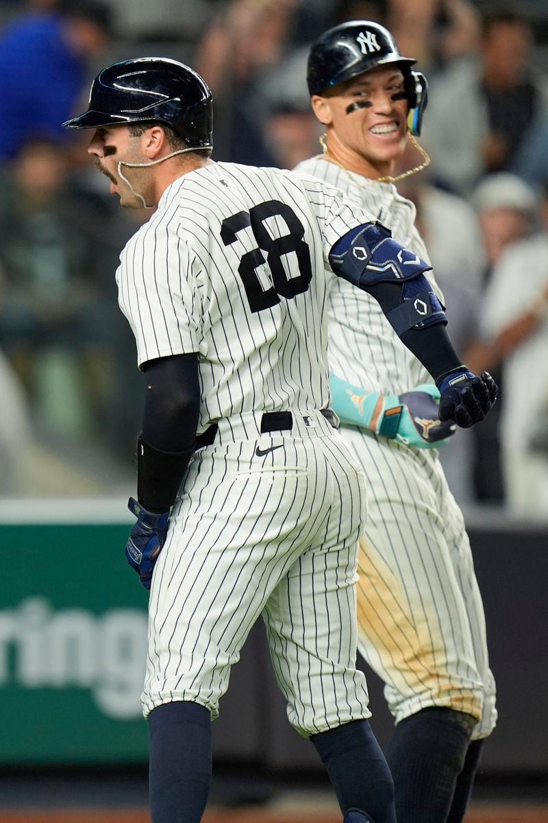 New York Yankees' Austin Wells (28) celebrates after his three-run home run with Aaron Judge, right, during the seventh inning of a baseball game against the Kansas City Royals at Yankee Stadium, Monday, Sept. 9, 2024, in New York. (AP Photo/Seth Wenig)