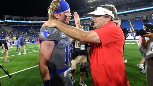 Georgia head coach Kirby Smart and Kentucky quarterback Brock Vandagriff (12) greet each other after Georgia beat Kentucky during an NCAA football game at Kroger Field, Saturday, September 14, 2024,  in Lexington, Kentucky. Georgia won 13-12 over Kentucky. Vandagriff is a former Georgia player. (Hyosub Shin / AJC)