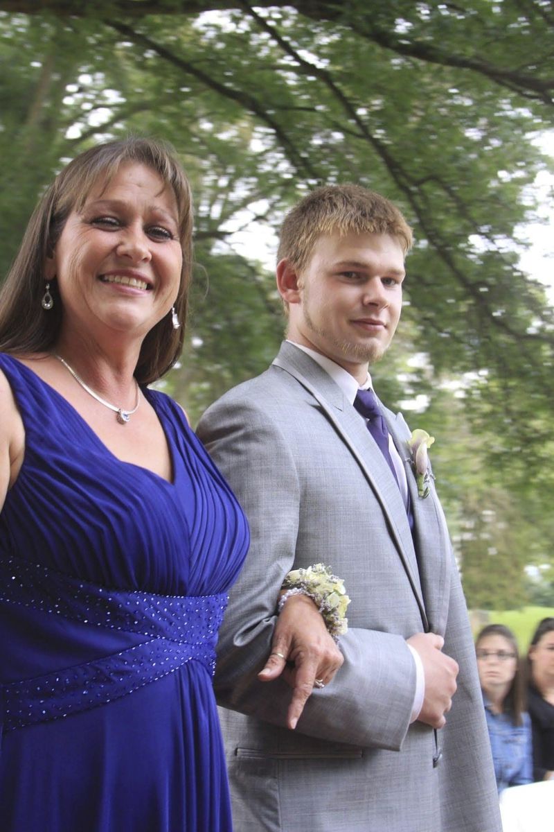 FILE - This 2012 family photo shows Austin Hunter Turner with his mother, Karen Goodwin, at the wedding of her oldest son. Turner died in 2017, at the age of 23, after an encounter with the Bristol Police Department. (Kim Rutledge via AP, File)