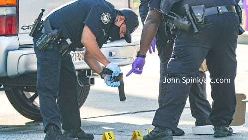 One man was shot at a northwest Atlanta gas station Friday morning during a fight over a stolen car, police said.