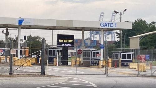 Fencing blocks a gate at the Georgia Ports Authority's Garden City Terminal, where union dockworkers went on strike Tuesday. Terminals in Savannah and Brunswick will remain closed until the labor dispute ends. (Adam Van Brimmer/AJC)