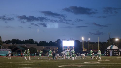 The sun sets as the Seckinger offense prepares to run a play against Roswell during the first half at Roswell High School, Friday, Sept. 20, 2024, in Roswell, Ga. (Jason Getz / AJC)

