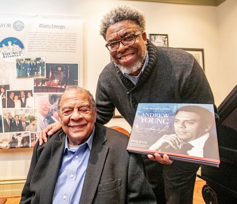 Andrew Young tells stories and poses with Ernie Suggs, of the Atlanta Journal-Constitution wrote the book after hours of interviews and decades following the Ambassador's life and career. (Jenni Girtman for The Atlanta Journal-Constitution)