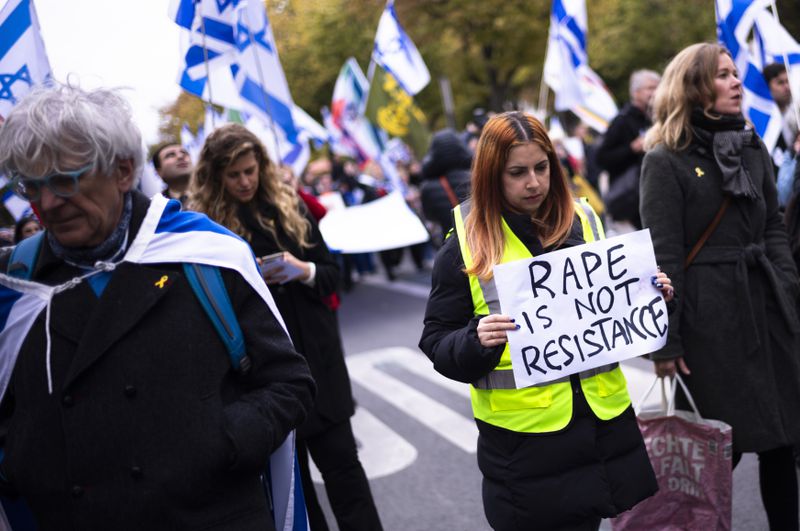 People attend a demonstration in support of Israel to mark the first anniversary of the Hamas attack on Israel, in Berlin, Germany, Sunday, Oct. 6, 2024. (AP Photo/Markus Schreiber)