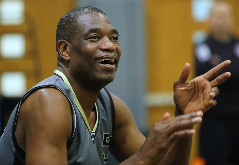 May 20, 2017, Atlanta: Dikembe Mutombo cheers on his teammates during the Breakthrough Atlanta Celebrity Basketball Game at the Lovett School on Saturday, May 20, 2017, in Atlanta.     Curtis Compton/ccompton@ajc.com