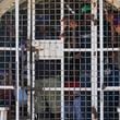 FILE - Undocumented Haitians detained by immigration officials stand inside a police vehicle, in Dajabon, Dominican Republic, May 17, 2024. (AP Photo/Matias Delacroix, File)