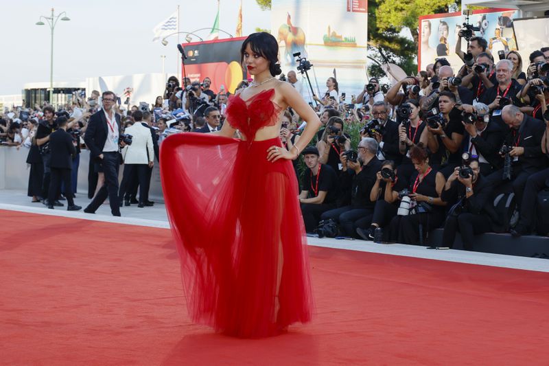 Jenna Ortega poses for photographers upon arrival for the premiere of the film 'Beetlejuice Beetlejuice' and the opening ceremony of the 81st edition of the Venice Film Festival in Venice, Italy, on Wednesday, Aug. 28, 2024. (Photo by Joel C Ryan/Invision/AP)