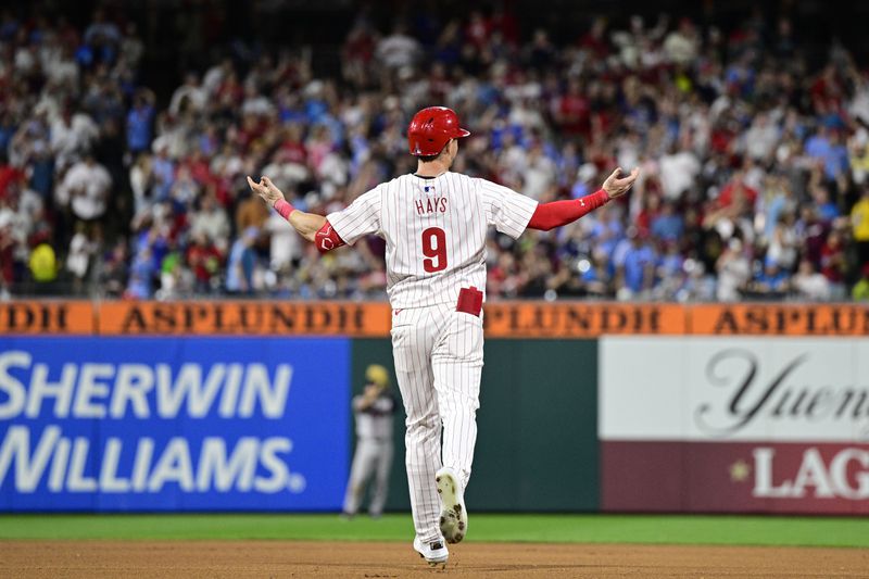 Philadelphia Phillies' Austin Hays reacts after a catch by Atlanta Braves' Michael Harris II during the seventh inning of a baseball game, Saturday, Aug. 31, 2024, in Philadelphia. (AP Photo/Derik Hamilton)