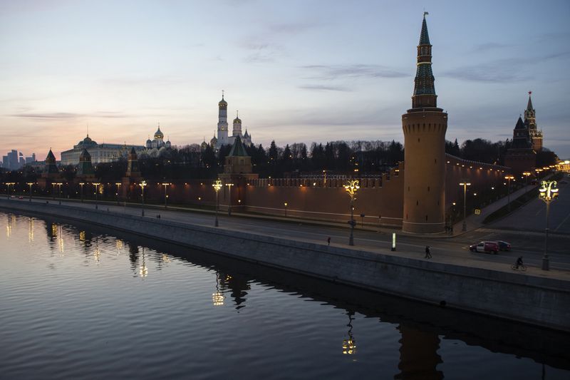 FILE - The Kremlin and embankment of the Moscow River are seen during sunset in Moscow, Russia, on Saturday, March, 28, 2020. (AP Photo, File)