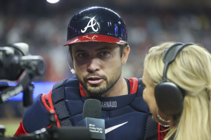 Atlanta Braves catcher Travis d'Arnaud talks with a tv reporter after the Braves 8-3 win against the Texas Rangers at Truist Park, Friday, April 19, 2024, in Atlanta. Atlanta Braves catcher Travis d'Arnaud had three home runs in the game. (Jason Getz / AJC)
