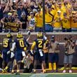 Michigan defensive back Will Johnson (2) celebrates his 42-yard interception for a touchdown against Southern California in the second half of an NCAA college football game in Ann Arbor, Mich., Saturday, Sept. 21, 2024. (AP Photo/Paul Sancya)