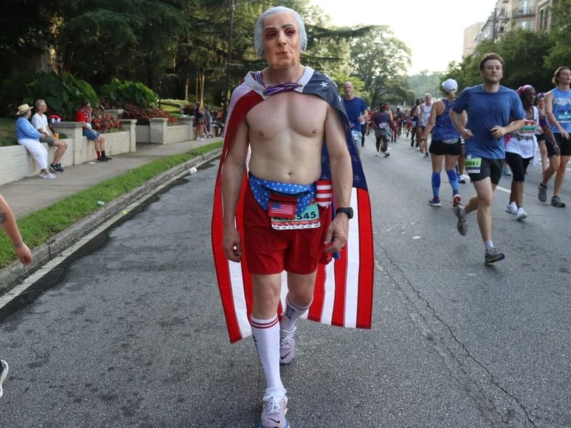 Trey Yearwood, 46, has dressed as George Washington for his past four of the past six AJC Peachtree Road Races. (Photos:  (Photo: Libby Hobbs/AJC)