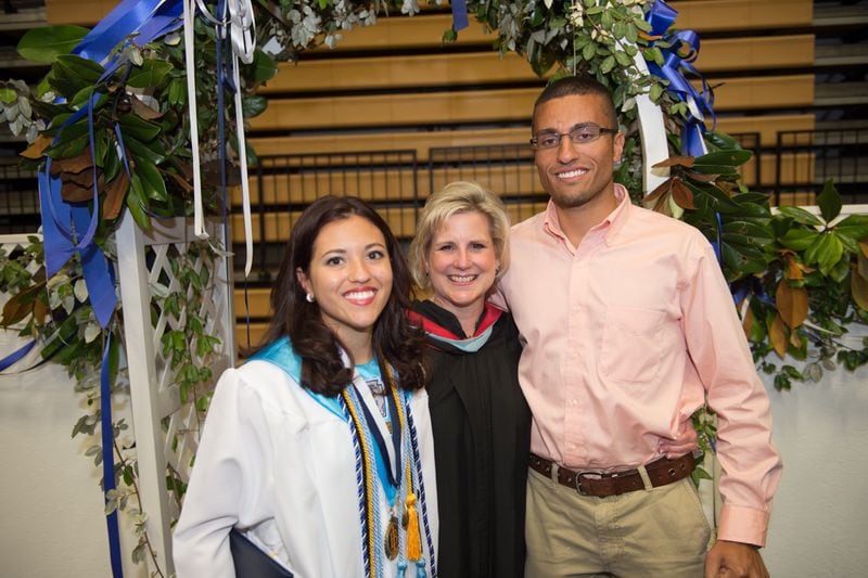 Marietta High School principal Leigh Colburn with Juanita Londono and her brother Juan at Juanita's graduation in May.
