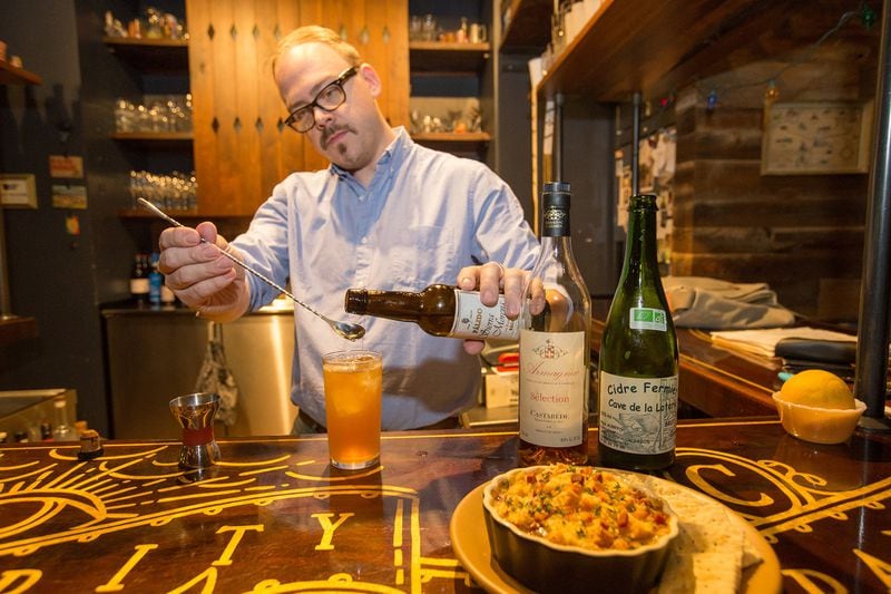 Greg Best mixes cider, brandy, bitters and tops the cocktail with sherry to create an Old Brick Wall at Ticonderoga Club in Krog Street Market. (Jenni Girtman / Atlanta Event Photography)