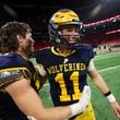 Prince Avenue Christian quarterback Aaron Philo (11) celebrates with teammates after their 49-32 win against Swainsboro in the Class A Division I GHSA State Championship game at Mercedes-Benz Stadium, Monday, December. 11, 2023, in Atlanta. (Jason Getz / Jason.Getz@ajc.com)