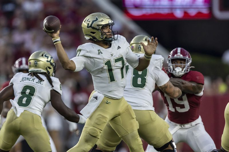 South Florida quarterback Byrum Brown (17) throws the ball against Alabama during the first half of an NCAA college football game, Saturday, Sept. 7, 2024, in Tuscaloosa, Ala. (AP Photo/Vasha Hunt)