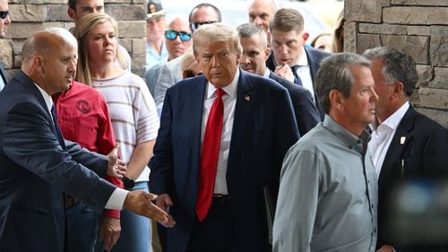 Former President Donald Trump and arrive at their Oct. 4 news conference about Hurricane Helene at the Columbia Performing Arts Center in Evans, Georgia. (Hyosub Shin/The Atlanta Journal-Constitution)