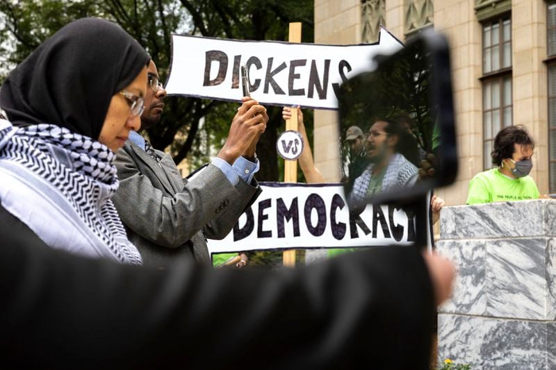 Opponents of an under-construction law enforcement training center, known to some as "Cop City," protest at City Hall in Atlanta on Monday, Sept. 16, 2024. It's been one year since opponents submitted a petition to force a referendum to block the project. (Arvin Temkar/Atlanta Journal-Constitution via AP)