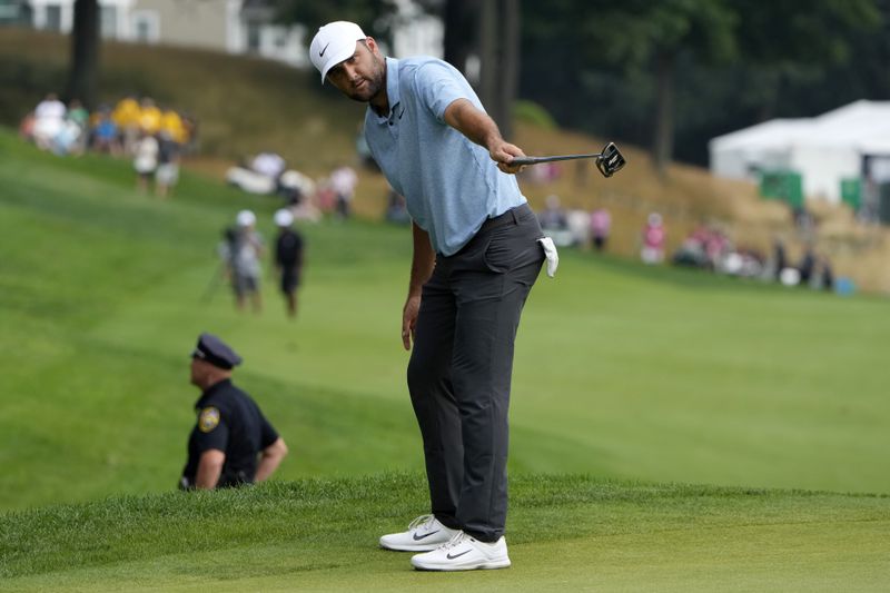 Scottie Scheffler reacts after missing a put on the 18th hole during the final round of the Travelers Championship golf tournament at TPC River Highlands, Sunday, June 23, 2024, in Cromwell, Conn. (AP Photo/Seth Wenig)