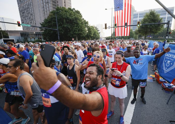 Runners prepare for the 53rd running of the Atlanta Journal-Constitution Peachtree Road Race in Atlanta on Sunday, July 3, 2022. (Miguel Martinez / Miguel.Martinezjimenez@ajc.com)