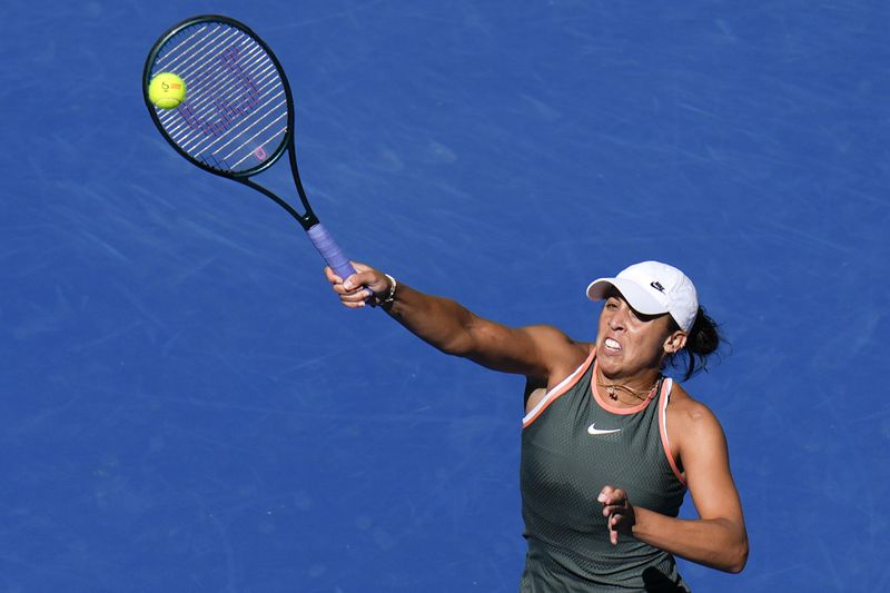 Madison Keys of the United States returns a shot from Aryna Sabalenka of Belarus during their women's singles match of the China Open tennis tournament at the National Tennis Center in Beijing, Wednesday, Oct. 2, 2024. (AP Photo/Andy Wong)