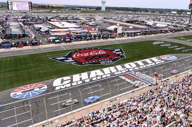 A pack of cars drives down the front stretch during a NASCAR Cup Series auto race at Charlotte Motor Speedway, Sunday, May 26, 2024, in Concord, N.C. (AP Photo/Matt Kelley)