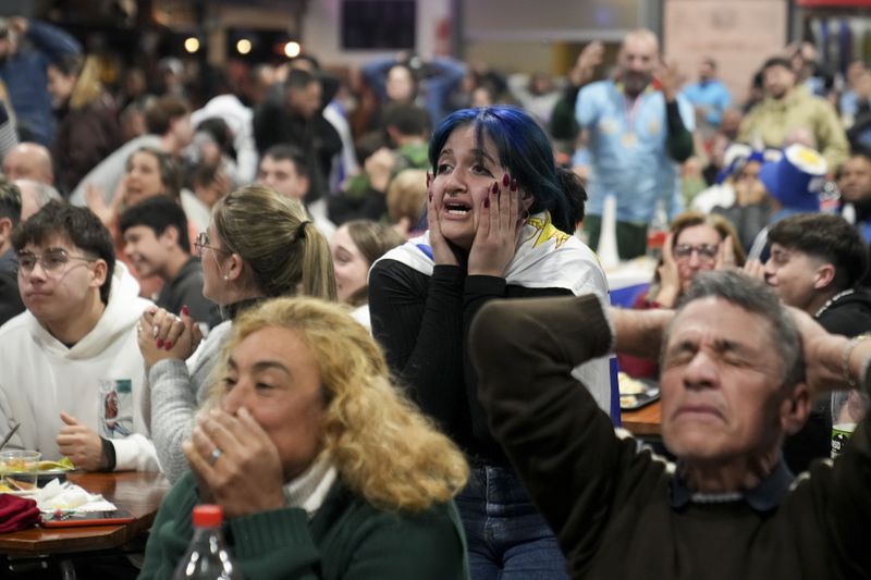Fans gather to watch a televised broadcast of the a Copa America semifinal soccer match between Uruguay and Colombia in Montevideo, Uruguay, Wednesday, July 10, 2024. (AP Photo/Matilde Campodonico)
