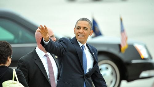 May 19, 2013 Atlanta - United States President Barack Obama leaves after he greeted members of a crowd gathered to greet him at Hartsfield-Jackson Atlanta International Airport on Sunday, May 19. President Obama visits Atlanta on Sunday to give a commencement speech at Morehouse and raise money for the Democratic Senatorial Campaign Committee at Arthur Blank's house. HYOSUB SHIN / HSHIN@AJC.COM President Barack Obama visits Atlanta in 2013 (AJC/Hyosub Shin)