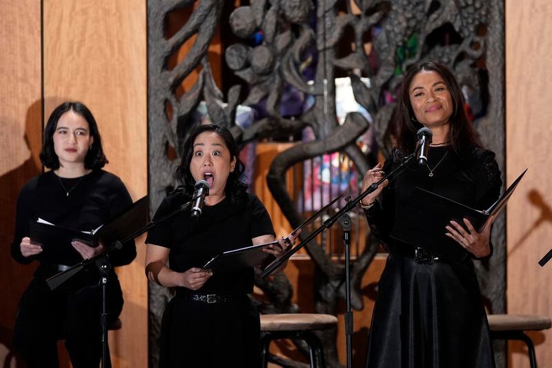 Kaitlyn Tanimoto, center, and Kimberly Green, right, perform in "What Do I Do With All This Heritage?" on Wednesday, May 22, 2024, in Los Angeles. The show offers more than 14 true stories of Asian American Jews. Lillian Mimi McKenzie is at left. (AP Photo/Ashley Landis)