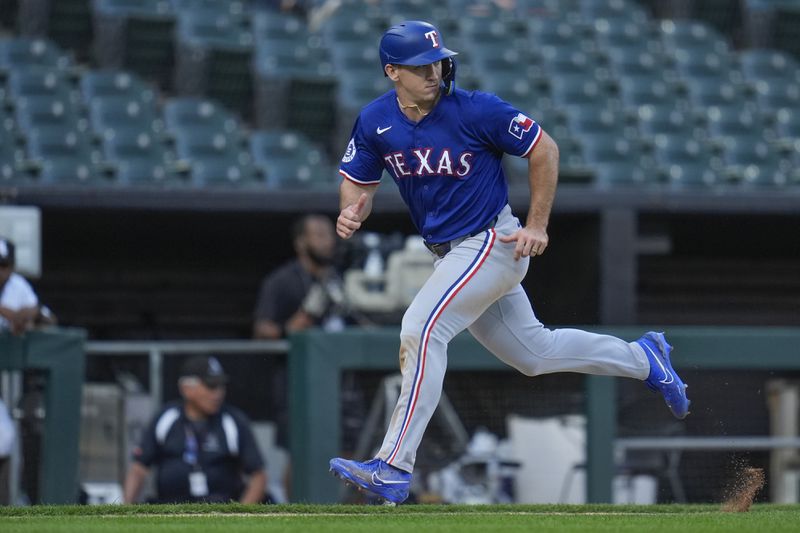 Texas Rangers' Jonah Heim runs the bases to score on a single from Corey Seager during the seventh inning of the first game of a baseball double header against the Chicago White Sox, Wednesday, Aug. 28, 2024, in Chicago. (AP Photo/Erin Hooley)