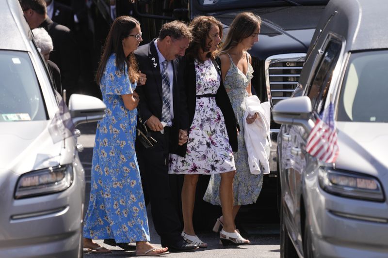 Mourners arrive for a funeral for Columbus Blue Jackets hockey player John Gaudreau Gaudreau and his brother Matthew Gaudreau at St. Mary Magdalen Catholic Church in Media, Pa., Monday, Sept. 9, 2024. (AP Photo/Matt Rourke)