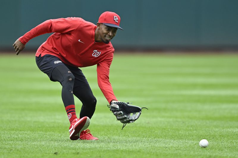 Washington Nationals' Darren Baker fields a grounder during outfield practice after being called up from the minor leagues before a baseball game against the Chicago Cubs, Sunday, Sept. 1, 2024, in Washington. (AP Photo/John McDonnell)