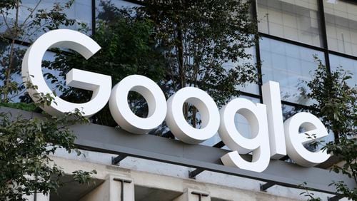 FILE - A Google sign hangs over an entrance to the company's new building, Sept. 6, 2023, in New York. (AP Photo/Peter Morgan, File)