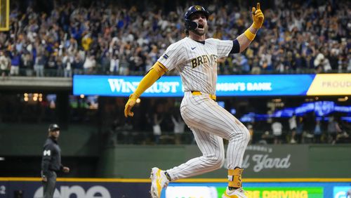 Milwaukee Brewers' Garrett Mitchell celebrates afrer hitting a two-run home run during the eighth inning of Game 2 of a National League wild card baseball game against the New York Mets Wednesday, Oct. 2, 2024, in Milwaukee. (AP Photo/Morry Gash)